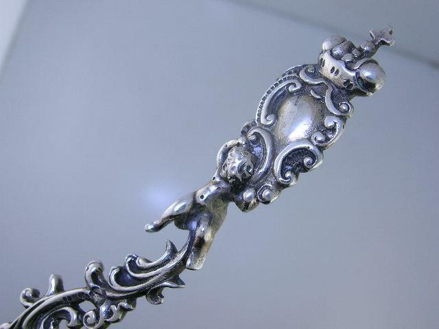 Old Dutch .833 Silver Figural Serving Spoon cherub / putti & scrolls c1895