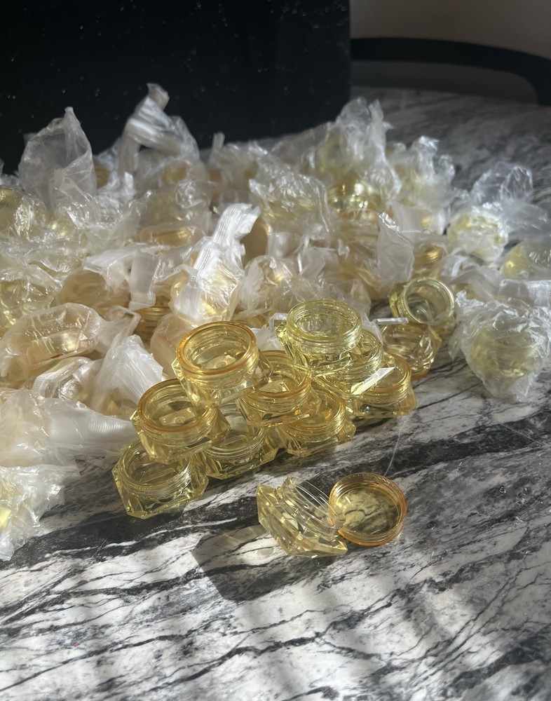 Yellow refillable diamond shaped bottles