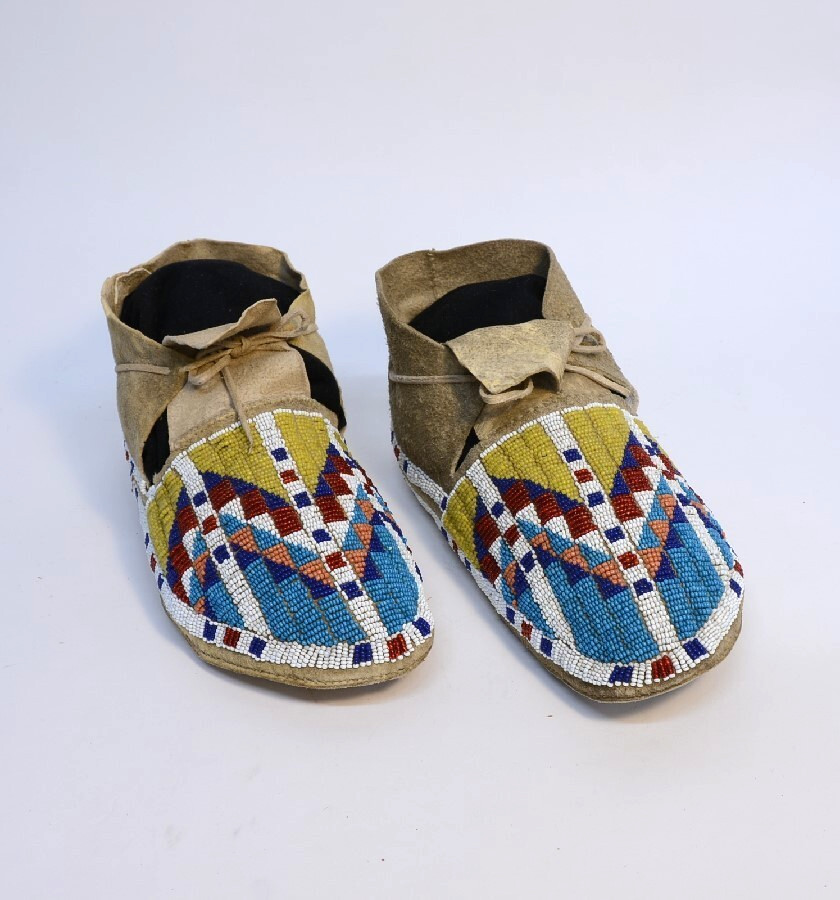 Antique Sioux Moccasins, painted parfleche interior soles