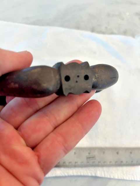 Antique figural hook with a man's face