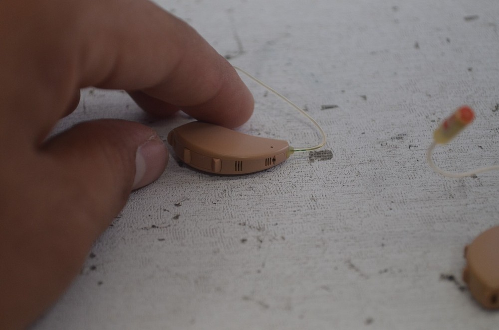 Resound Hearing Aids as is not tested missing button , might affect function