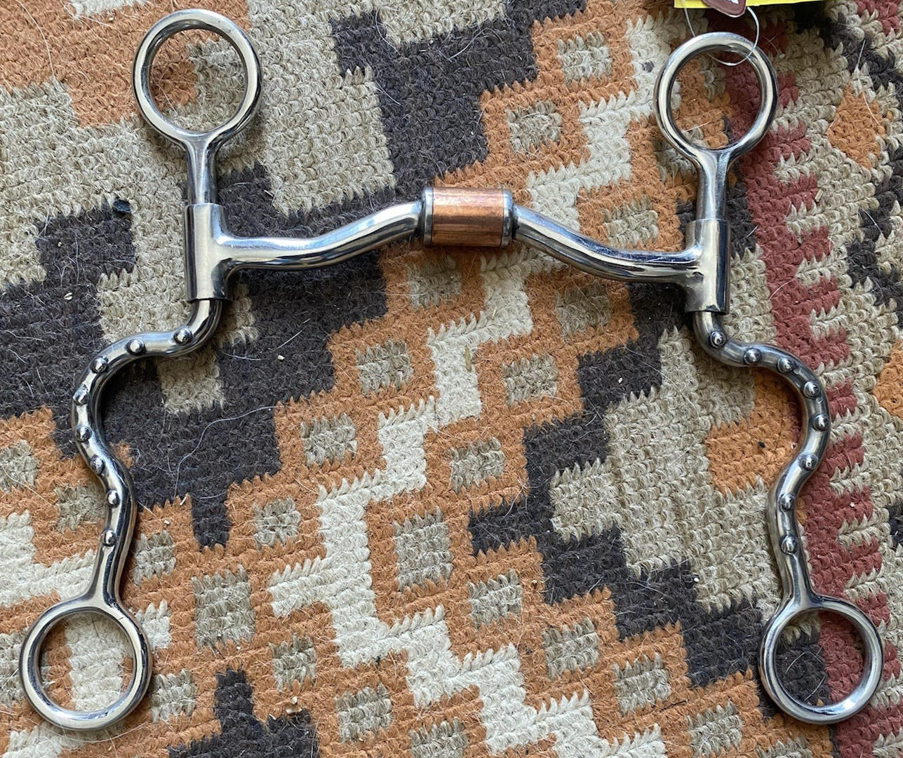 Low port barrel mouth SI Western bit w/spotted cheeks, independent side movement