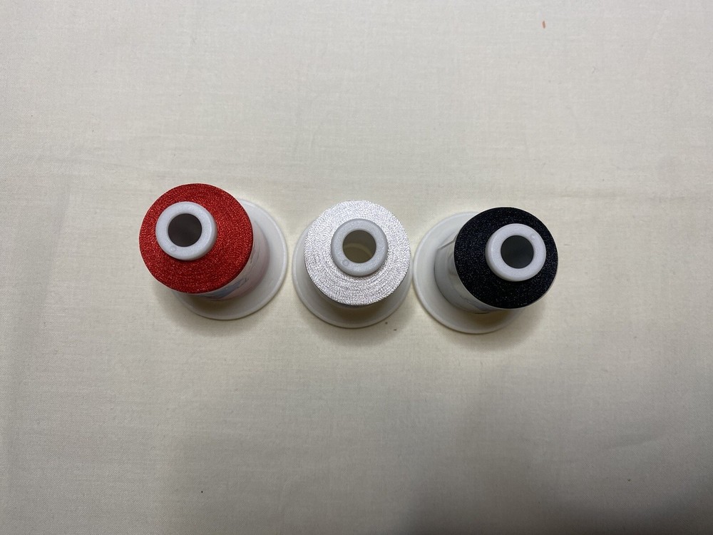 White, black and red spools (1 each) of new Simthread embriodery thread