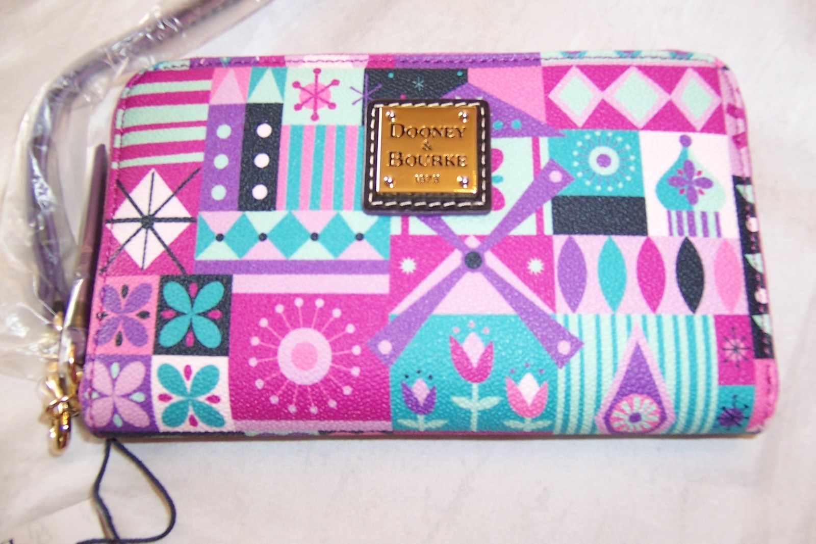 Authentic DisneyParks "It's a Small World" wristlet wallet; NWT; Dooney & Bourke