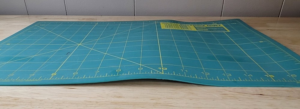 OLFA ROTARY CUTTING MAT & 2 CUTTERS