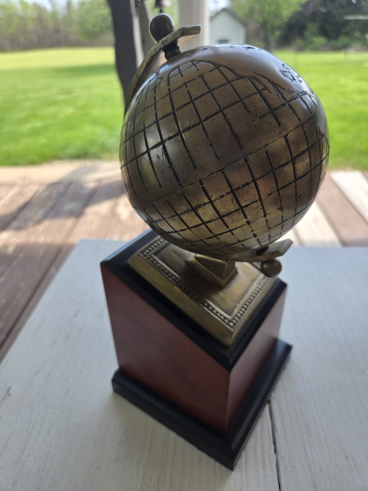 Brass Globe Bookend with wood base. One