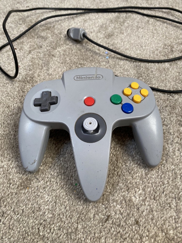 nintendo 64 console with hookups and 1 controller