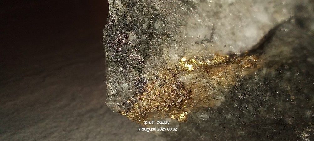 Precious metal bearing rock