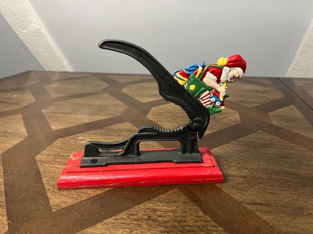 Old Fashioned Nutcracker Cast Iron on Wood Base santa theme nutcracker vintage
