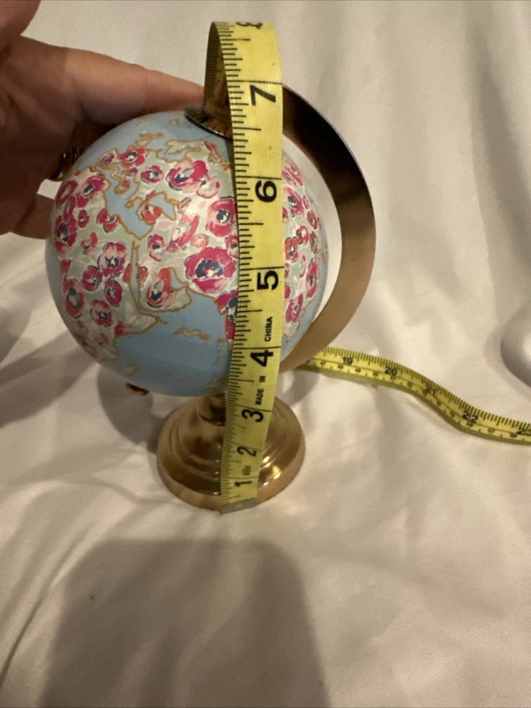 World Globe With Flowers By Threshold?