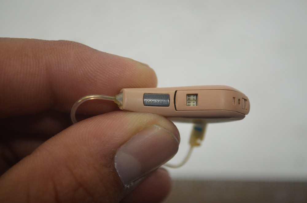 Resound Hearing Aids as is not tested missing button , might affect function