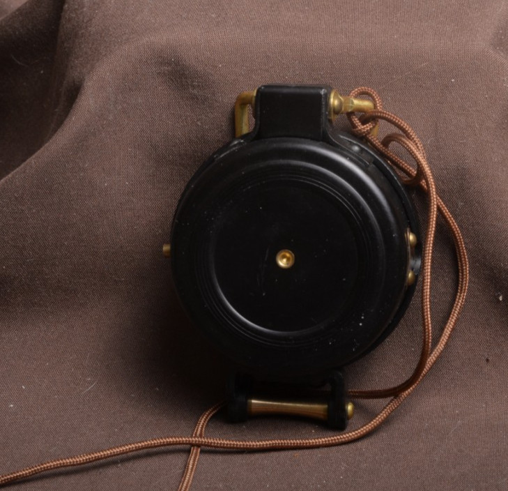 two lensatic compasses one with box