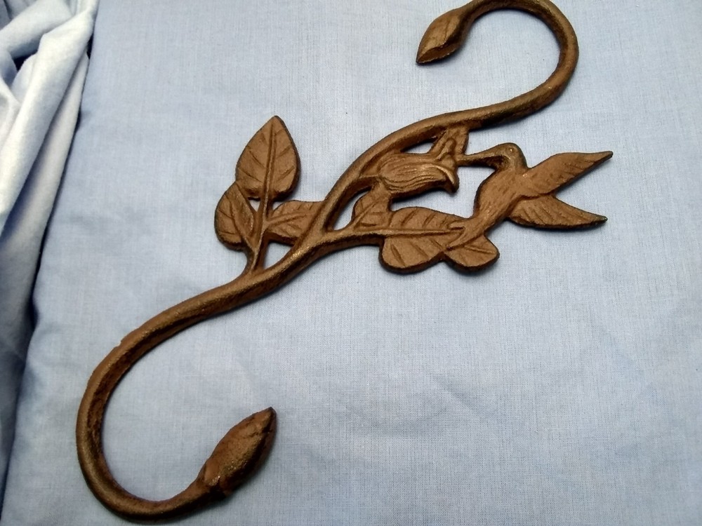 Hummingbird plant hook cast iron.