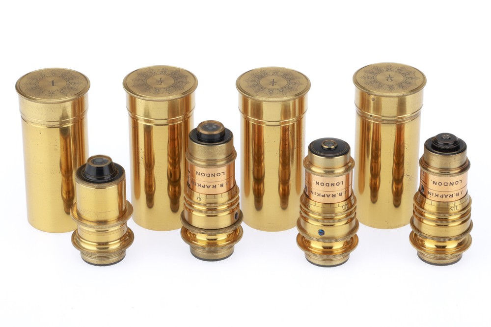 Very large binocular microscope in case with accessories.