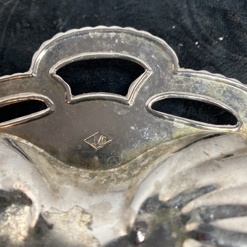 Scallopped edge silver colored dish