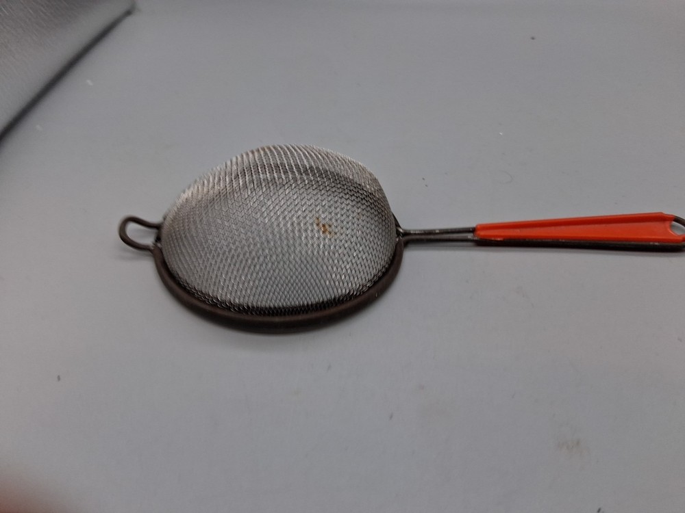 MCM Orange Vintage Bakelite Strainer