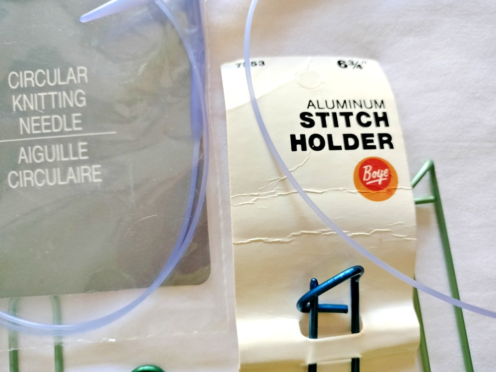 2 circluar knitting needles & 9 stitch holders