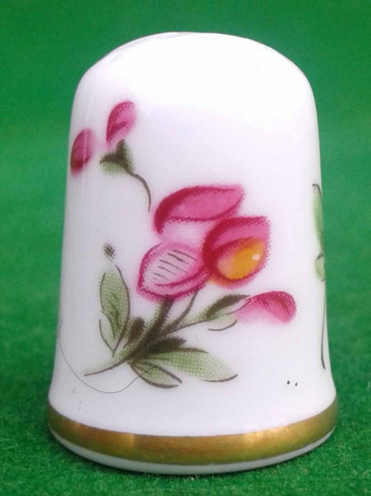 9 CAVERSWALL BONE CHINA THIMBLES.
