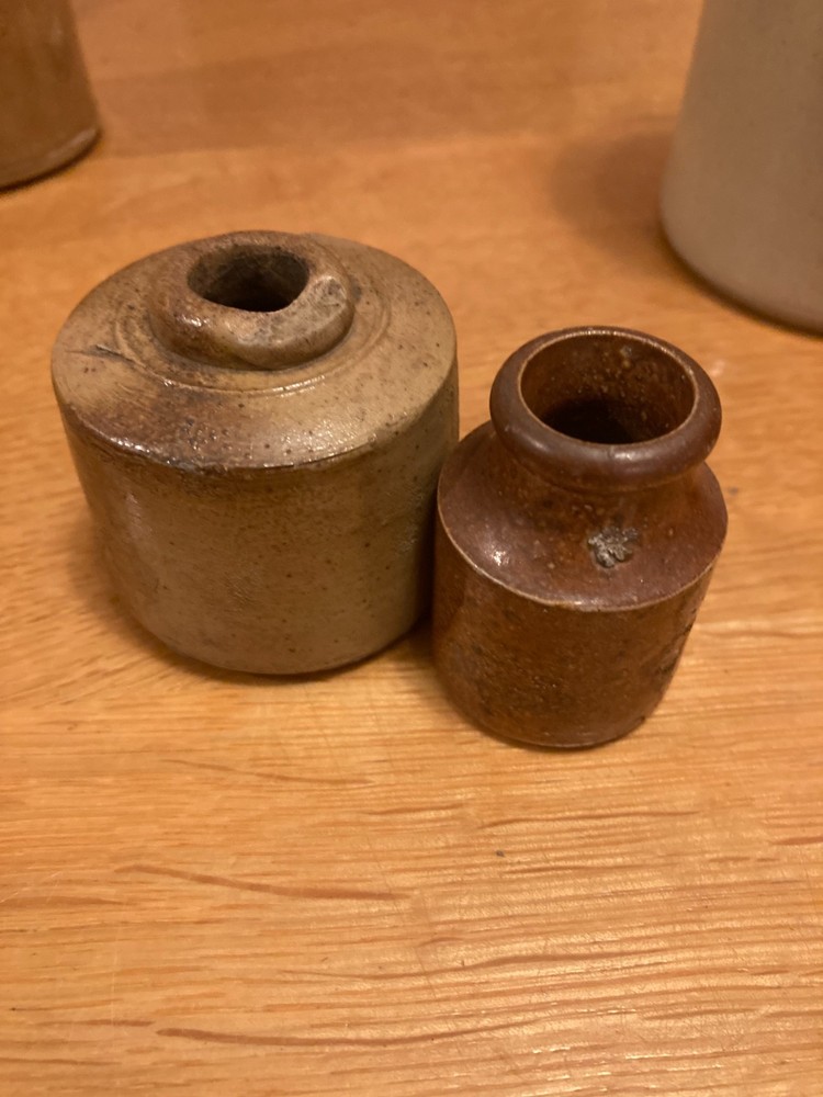Vintage stone bottle collection in decent condition.
