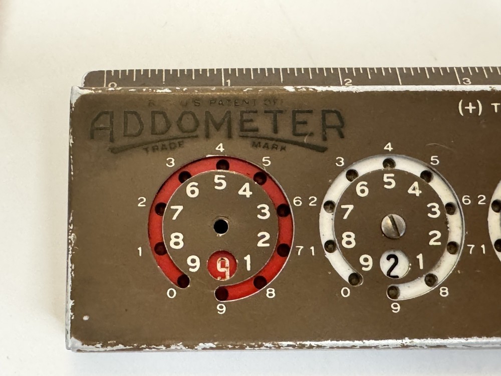 Addometer stylus-operated adding machine. Vintage mechanical calculator.