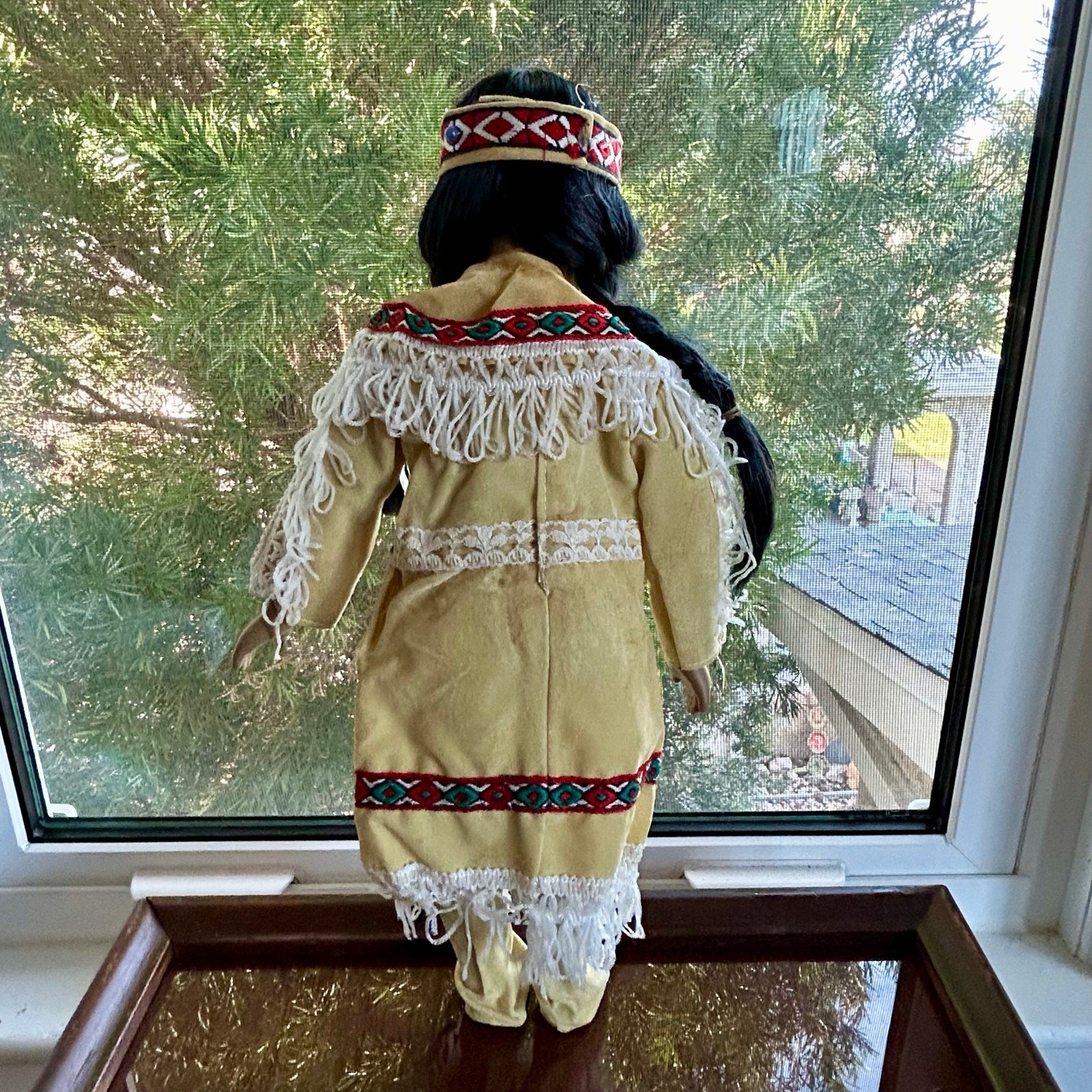 Vintage Porcelain Native American-Inspired Doll with Braids and Beaded Outfit