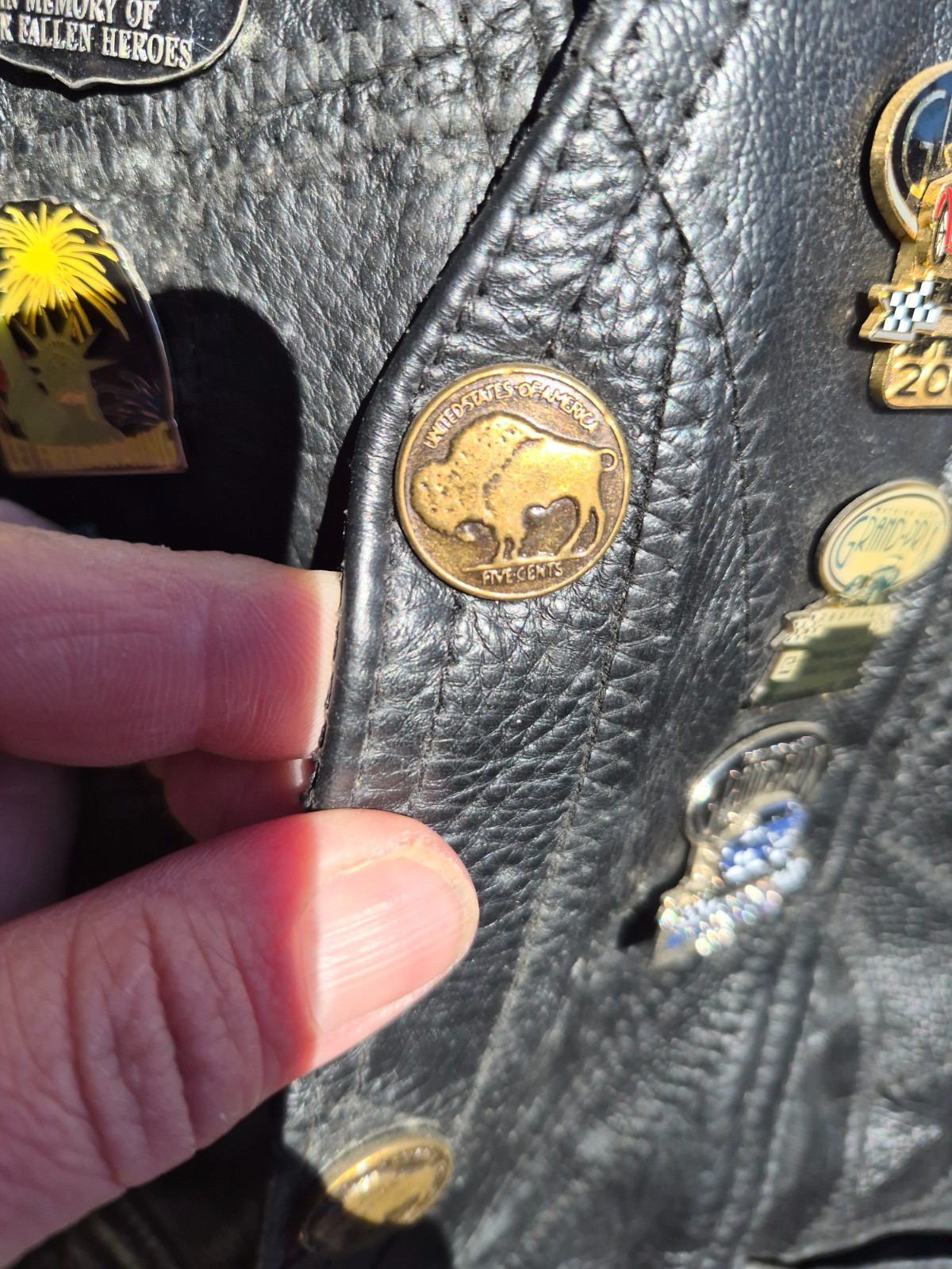 Vintage harley hog leather vest filled with pins and has patches 2xl