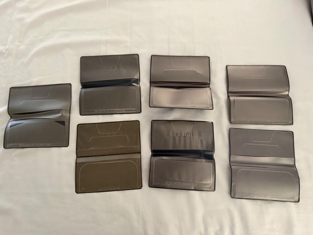 Checkbook register holders (7) blue, dark blue, and black