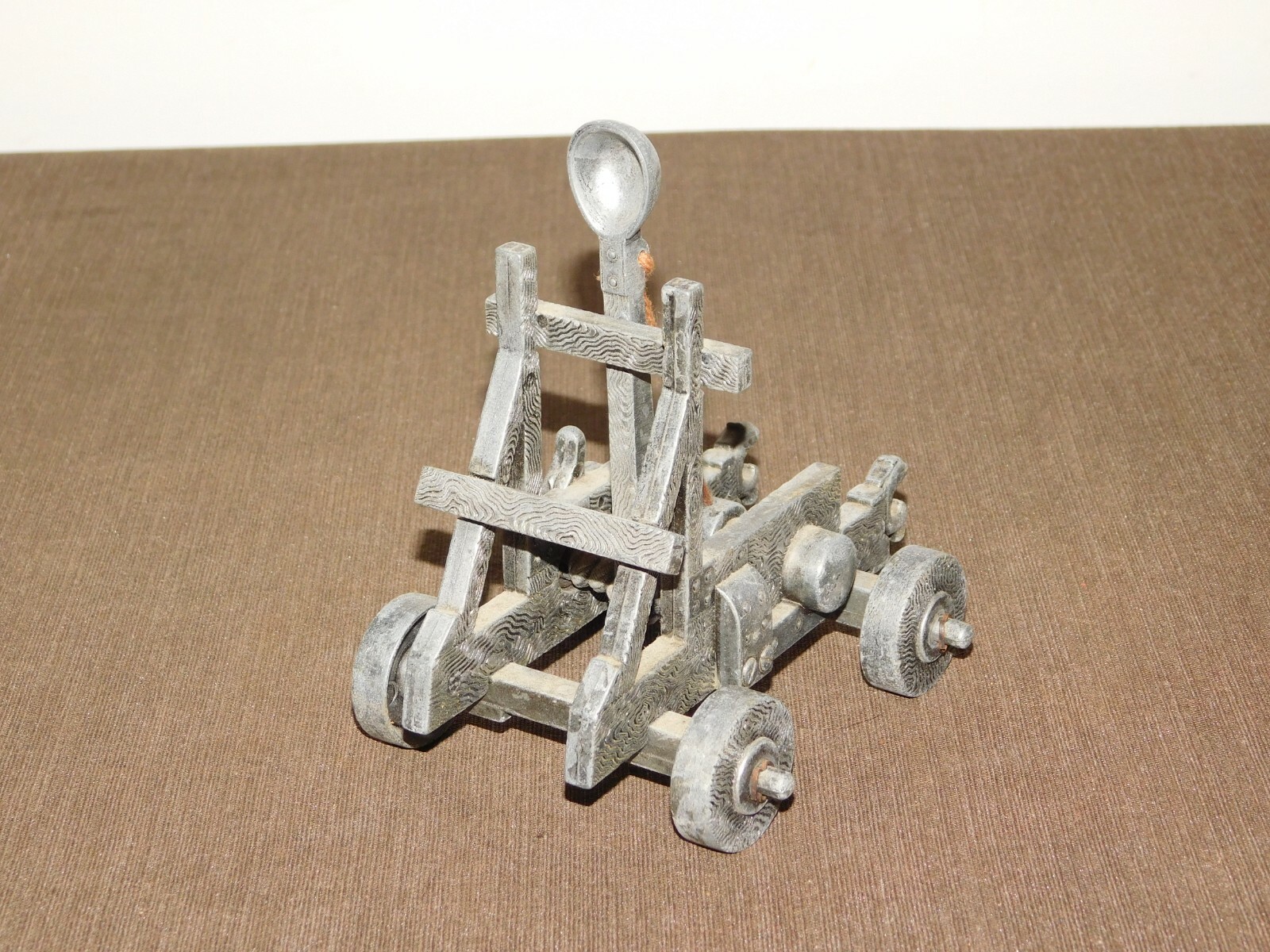 VINTAGE TOY 5" X 4" X 5 1/2" HIGH  METAL CATAPULT
