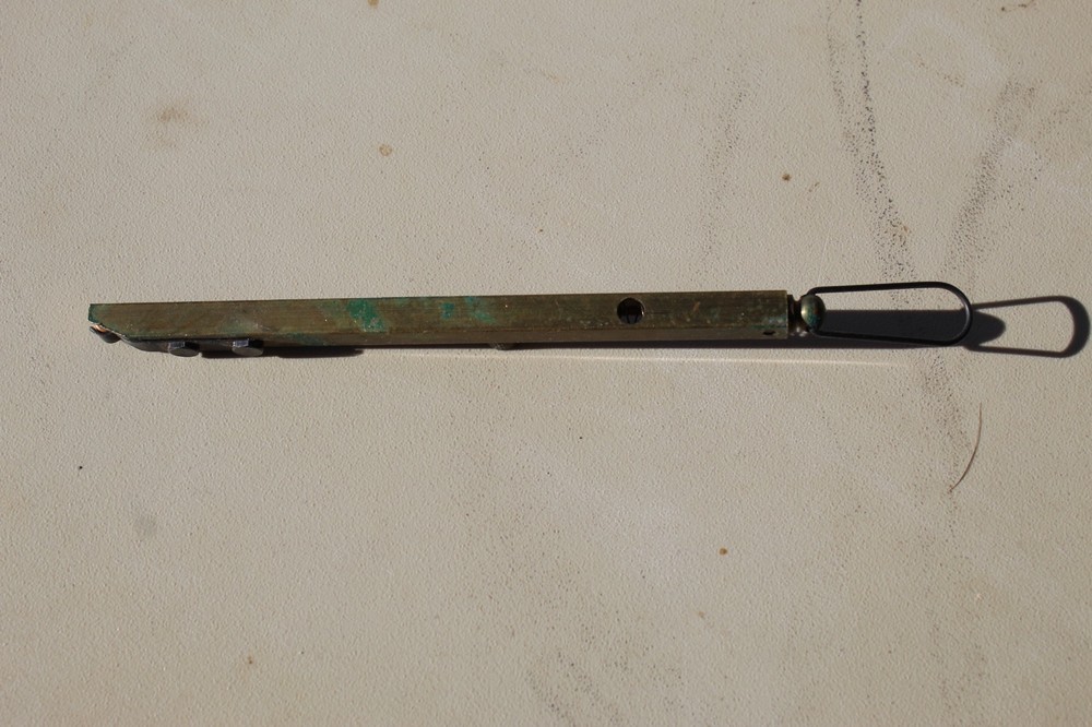 Brass straight-line percussion capper