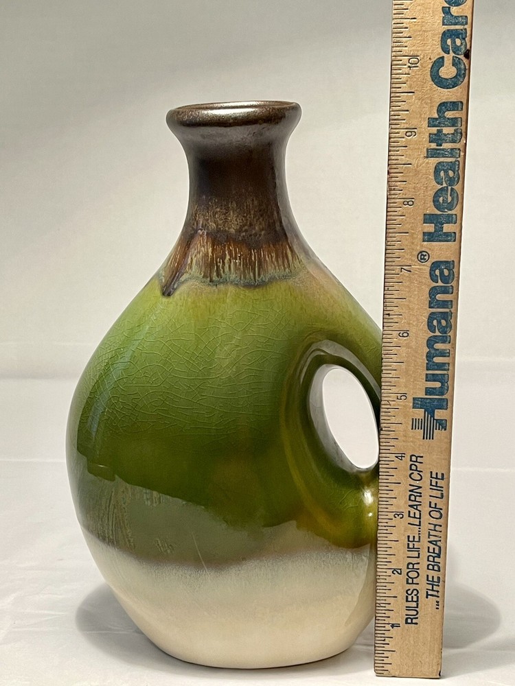 vintage ceramic vase with earth tones