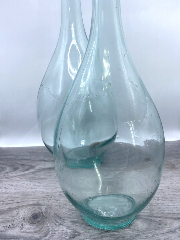 Two old wine bottles - 1 Cork inside - Label Residue