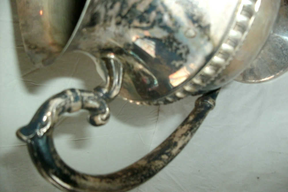 VINTAGE SILVER ON COPPER PITCHER, ENBLEM ON BOTTOM, 9 1/2" TALL