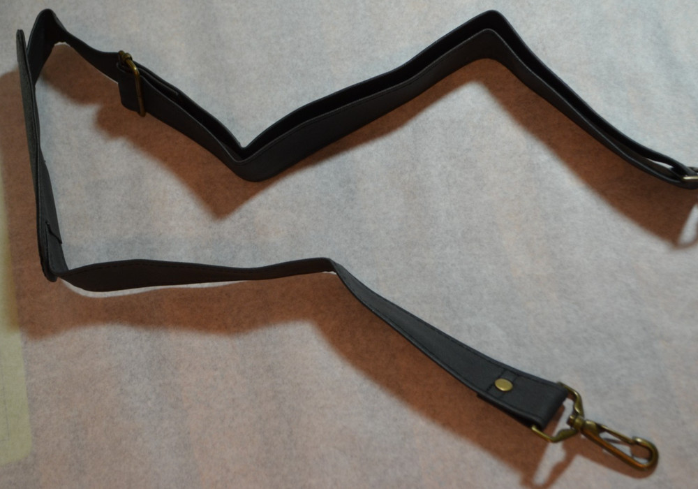 faux black leather adjustable (approx. 36-48") bag strap with shoulder pad