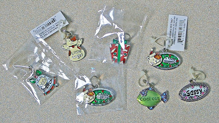 Seven (7) GANZ Engravable Metal Pet Tags