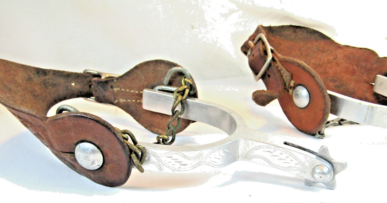 PAIR OF UNMARKED ENGRAVED ALUMINUM AIRPLANE METAL RIDING SPURS W/ STRAPS