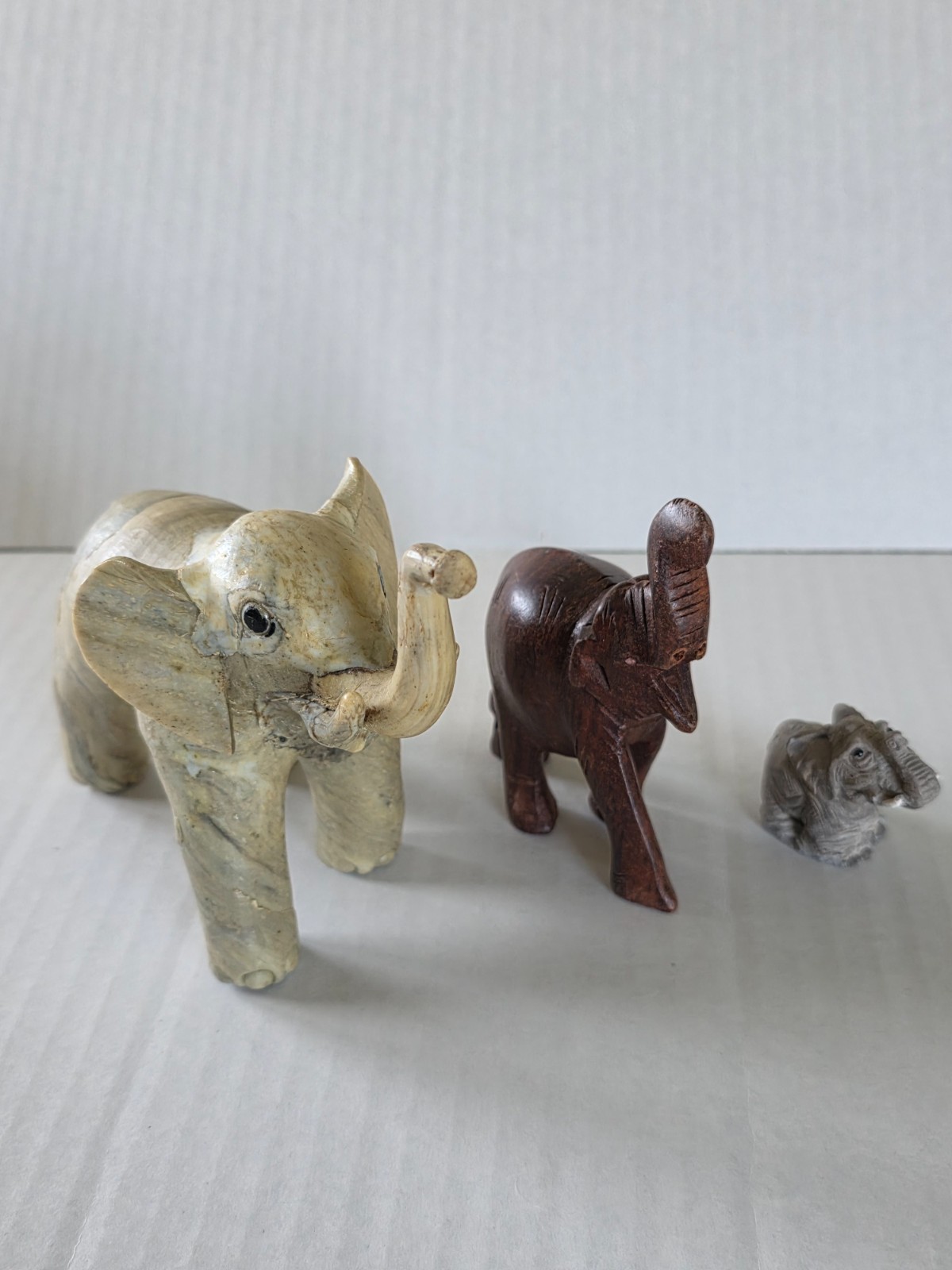 Three elephant figurines