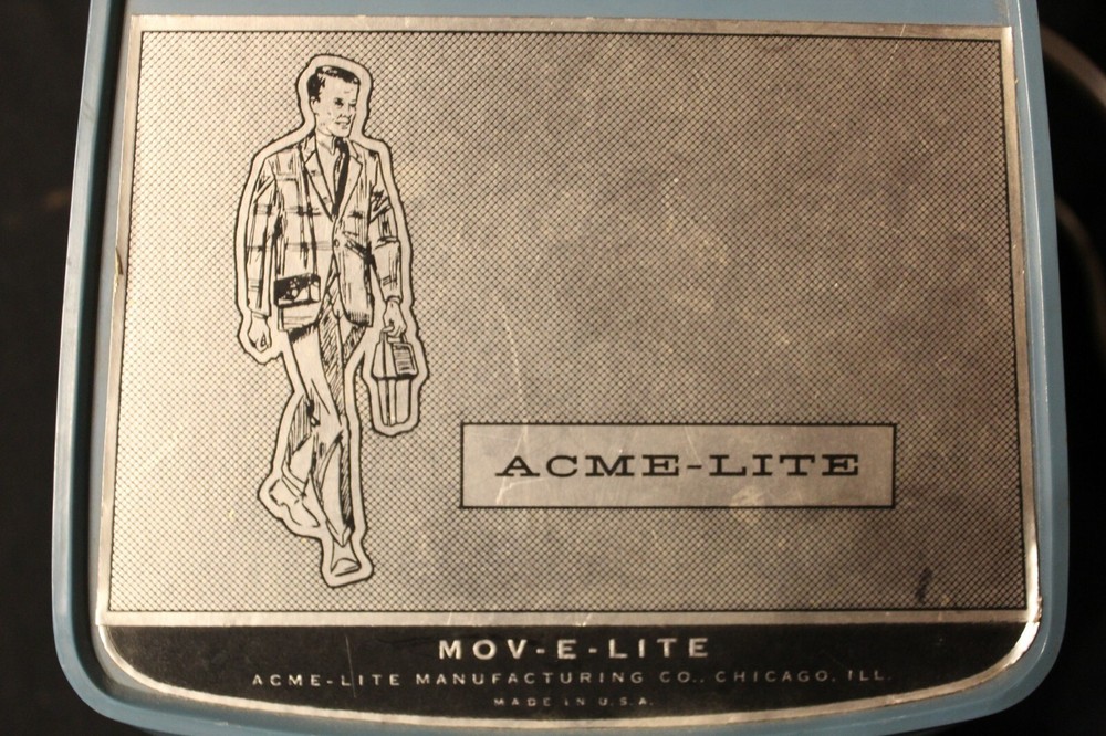 VINTAGE ACME-LITE MOV-E-LITE! TESTED AND WORKS NICE GRAPHICS ON CASE!