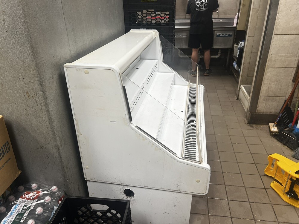 Reach in refrigerated merchandiser