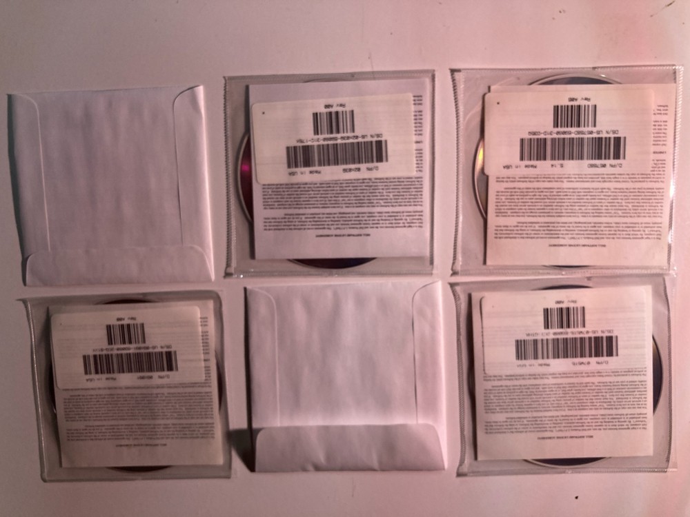 Six (6) - 2002 Dell Installation Discs; Drivers & Utilities; Roxio; CyberLink;
