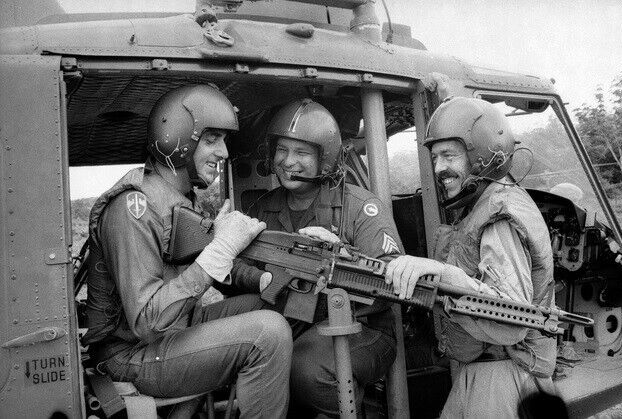 Vietnam War Photos -- UH-1 Huey + Door Gunner