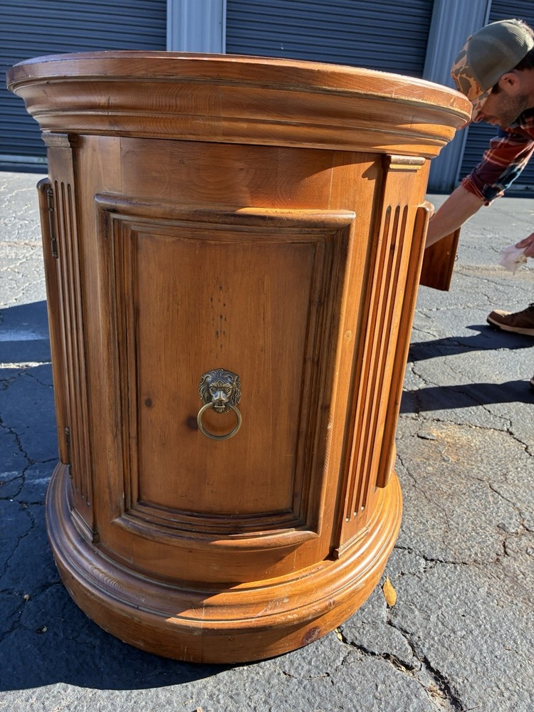 This Ethan Allen Tuscan Oval Cabinet Drum Table