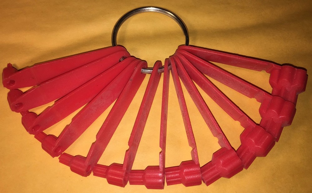 PLASTIC TORX IDENTIFIER SET ON A LARGE METAL RING IDENTIFIES TORX AND E-TORX