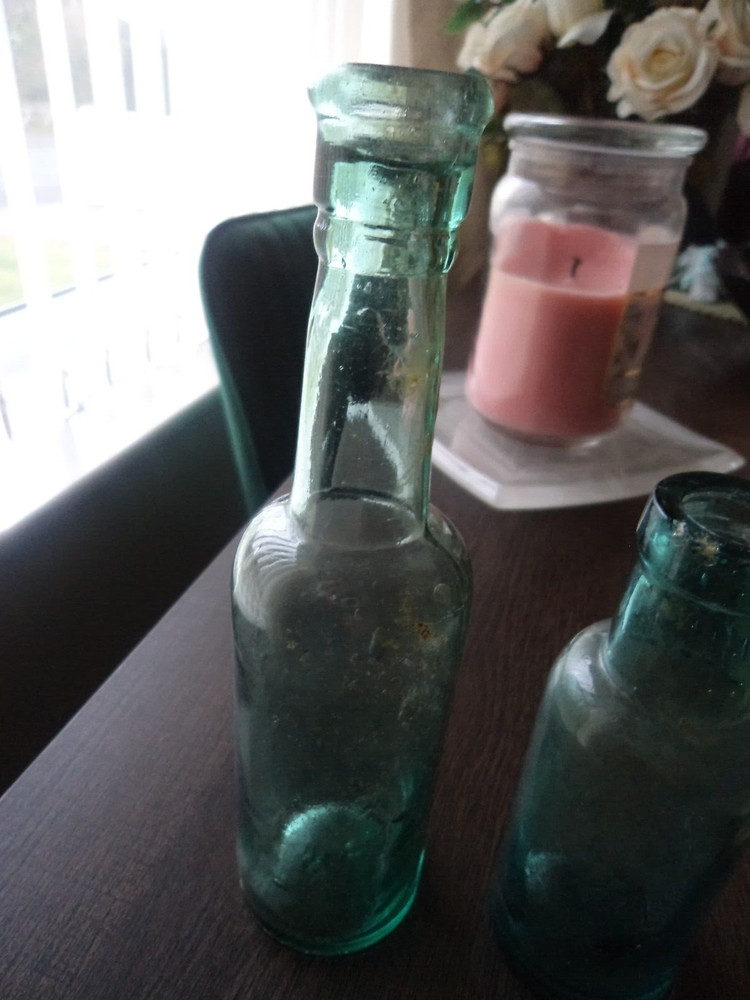 2 x antique aqua coloured bottles