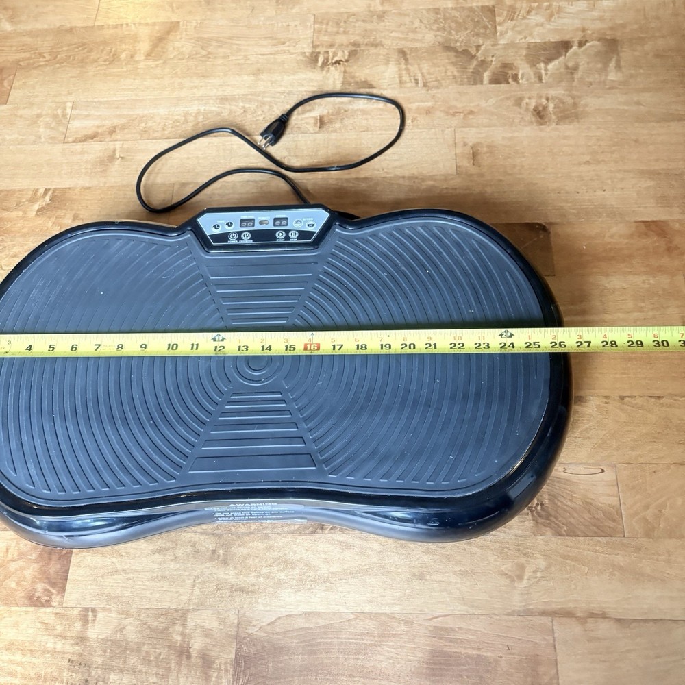 Black Vibration Plate Exercise Machine. Full-Body Vibrating Platform with Resist