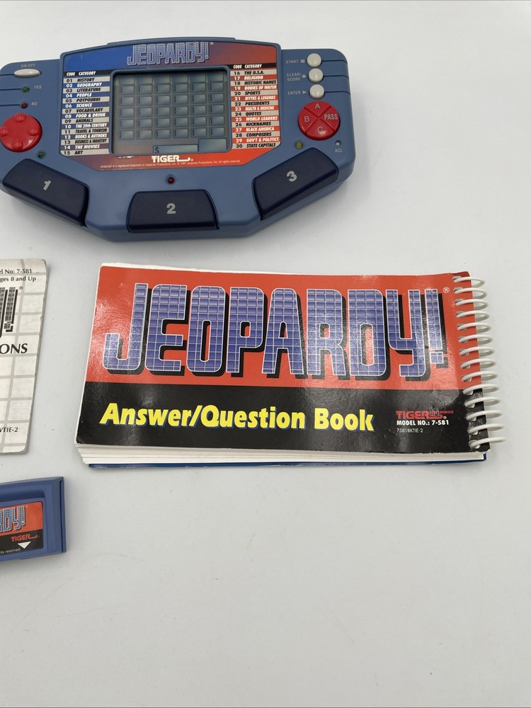 Tiger Electronics Jeopardy Hand Held Game 1995 with Answer Book & Manual E1