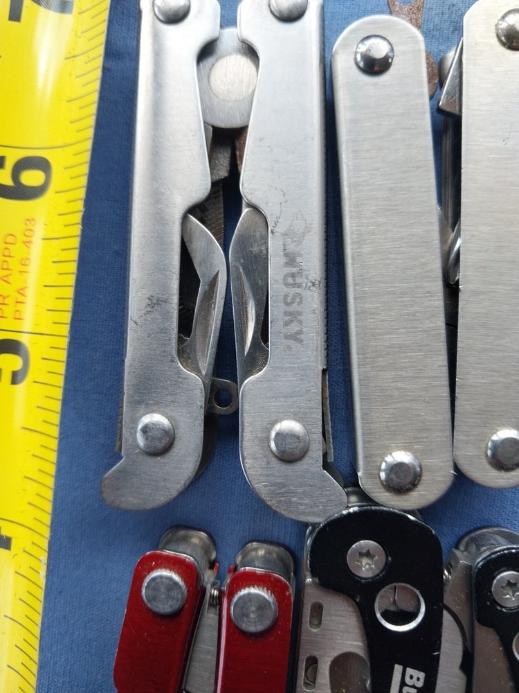 4 small multitudes with pliers knife scissors screwdriver's