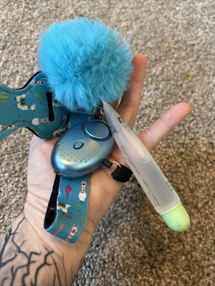 a self-defense keychain set with various accessories.