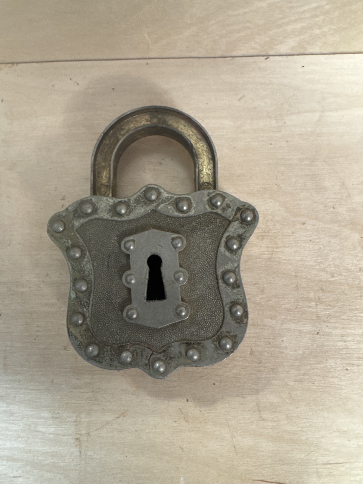 vintage Hubley Padlock Cap, a unique toy from the mid-20th century