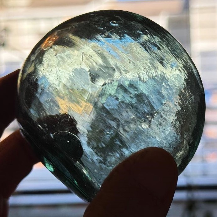 Crude aqua-green glass float, 3 1/4 inches diameter