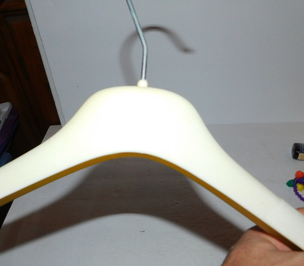 NICE IVORY COLOR PLASTIC ESCADA CLOTHES HANGER